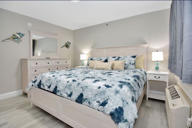 King bedroom with coastal style and streaming TV