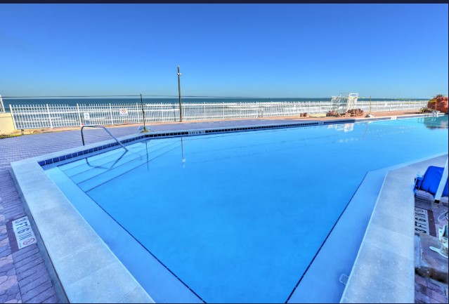 Large pool deck overlooking the beach