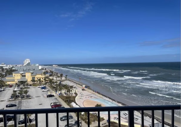 Oceanfront-balcony-with-wide-open-beach-and-pier-views