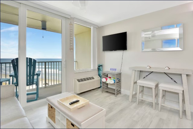 Open living area with sleeper sofa and streaming TV and work space