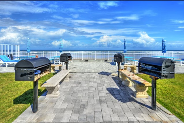 Picnic tables and grills Poolside relaxation area